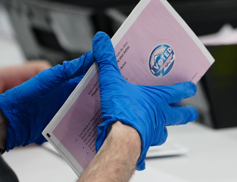 Election workers at the Washoe County Registrar of Voters office process ballots during February's presidential primary.