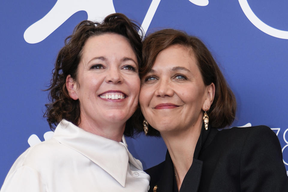 Olivia Colman, left, and Maggie Gyllenhaal pose for photographers at the photo call for the film 'The Lost Daughter' during the 78th edition of the Venice Film Festival in Venice, Italy, Friday, Sep, 3, 2021. (AP Photo/Domenico Stinellis)