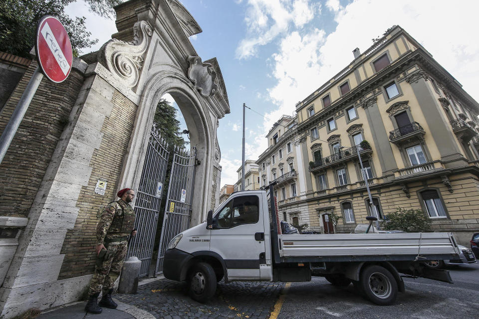 A military soldier guards the entrance of the Apostolic Nunciature, the Vatican's embassy to Italy, in Rome, Wednesday, Oct. 31, 2018. The Vatican said Tuesday that human bones were found during renovation work near its embassy to Italy, reviving talk about one of the Holy See's most enduring mysteries — the fate of the 15-year-old daughter of a Vatican employee who disappeared in 1983. (Fabio Frustaci/ANSA via AP)