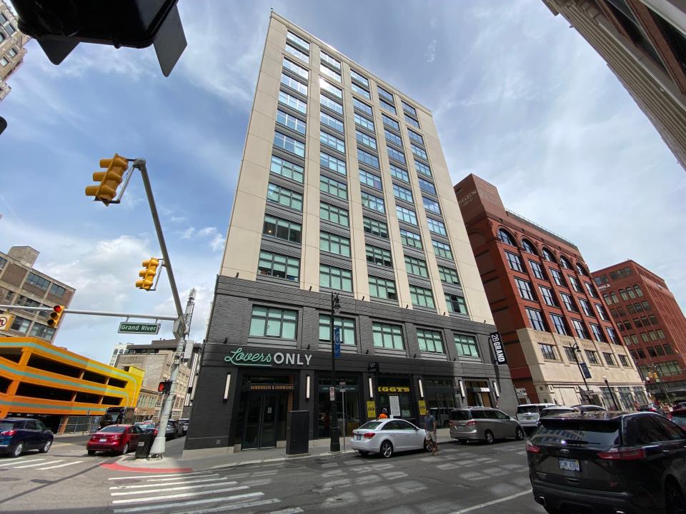 Another apartment building in Detroit on a busy street