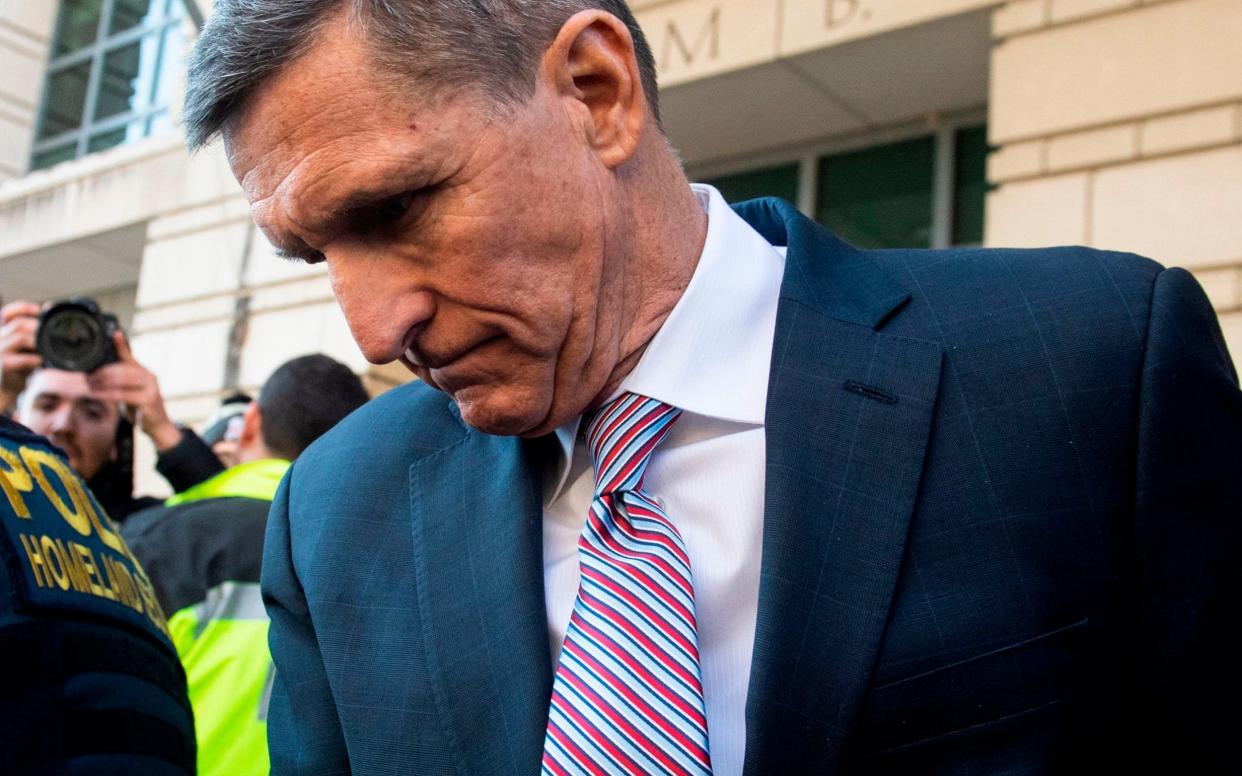 Michael Flynn leaves after the delay in his sentencing hearing at US District Court in Washington, DC - AFP