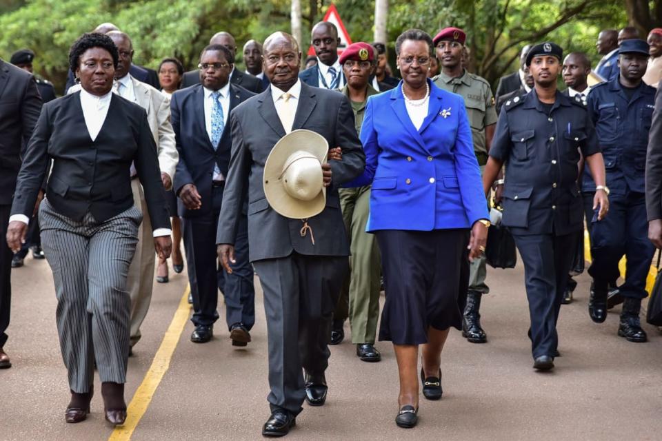 Uganda’s President Yoweri Museveni (C) walks with First Lady Janet Museveni (R) and Speaker of Parliament Rebecca Kadaga (L) after delivering the state of the nation address in front of Members of Parliament and diplomats in Kampala, Uganda, on June 6, 2018. (Photo by NICHOLAS BAMULANZEKI/AFP via Getty Images)