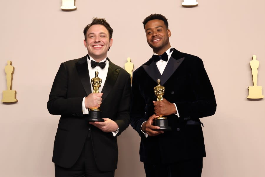 HOLLYWOOD, CALIFORNIA – MARCH 10: (L-R) Ben Proudfoot and Kris Bowers, winners of the Best Documentary Short Film award for “The Last Repair Shop”, pose in the press room during the 96th Annual Academy Awards at Ovation Hollywood on March 10, 2024 in Hollywood, California. (Photo by John Shearer/WireImage)