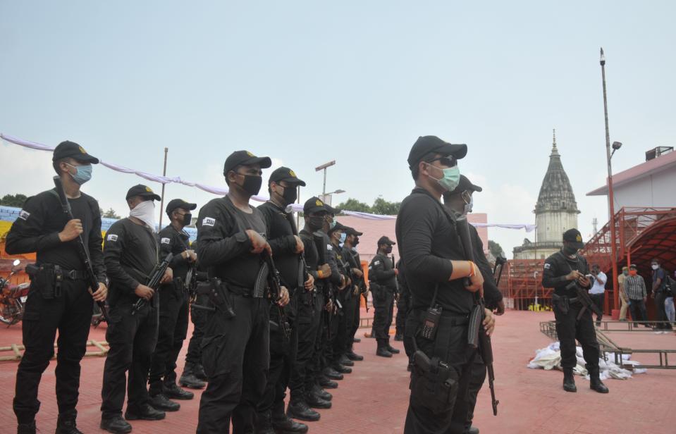 AYODHYA, INDIA - AUGUST 4: NSG commandos on alert at Hanuman Garhi temple on the eve of the foundation stone laying ceremony of the Ram Janmabhumi temple on August 4, 2020 in Ayodhya, India. Prime Minister Narendra Modi will on Wednesday attend a public function on laying of the foundation stone of 'Shree Ram Janmabhoomi Mandir' at Ayodhya. Ram Janmabhoomi Teerth Kshetra, the trust set up for the construction and management of Ram temple, has invited 175 eminent guests for the foundation stone-laying ceremony after personally discussing with BJP veterans L K Advani and Murli Manohar Joshi, lawyer K Parasaran and other dignitaries. (Photo by Deepak Gupta/Hindustan Times via Getty Images)