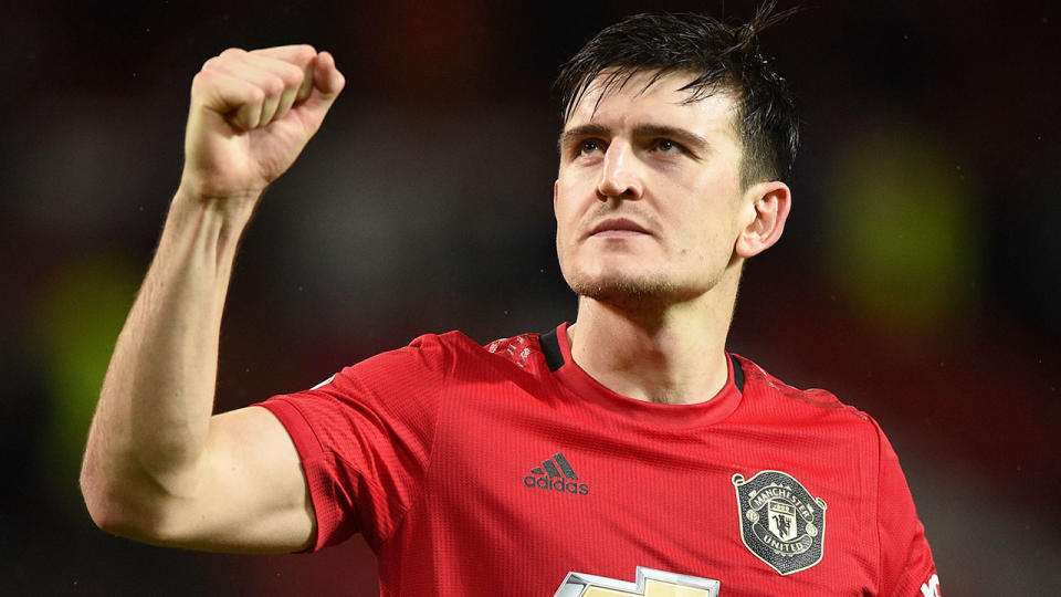 Pictured here, Harry Maguire salutes to fans during a game for Manchester United.