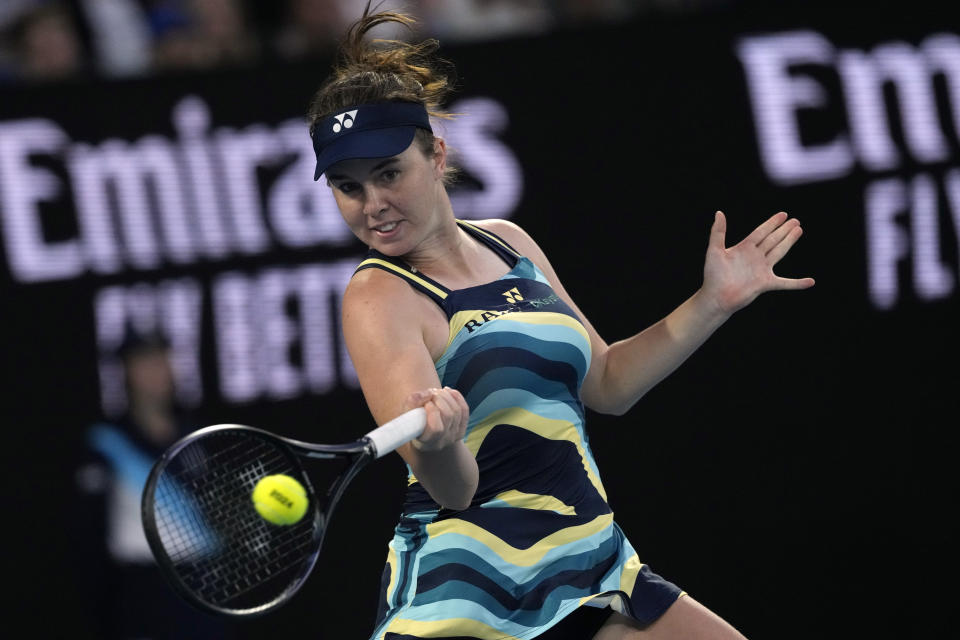 Linda Noskova of the Czech Republic plays a forehand return to Iga Swiatek of Poland during their third round match at the Australian Open tennis championships at Melbourne Park, Melbourne, Australia, Saturday, Jan. 20, 2024. (AP Photo/Andy Wong)