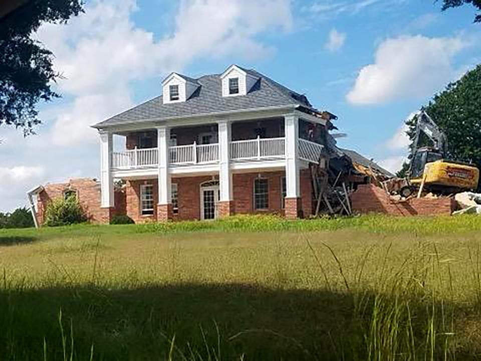 Wes and Samantha Brewer's custom-designed, 3,600-square-foot house, shown in 2001, was acquired through eminent domain and destroyed by the Oklahoma Turnpike Authority in 2018.