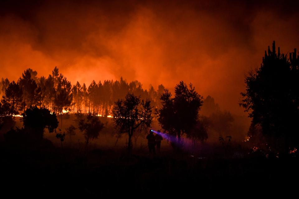 Firefighters are at work to extinguish a wildfire in Cardigos village in Macao, central Portugal on July 21, 2019. (Photo: Patricia De Melo Moreira/AFP/Getty Images)