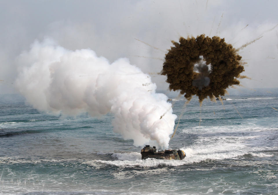 A South Korean marine LVT-7 landing craft sail to shores through a smoke screen during the U.S.-South Korea joint landing exercises called Ssangyong, part of the Foal Eagle military exercises, in Pohang, South Korea, Monday, March 31, 2014. South Korea said North Korea has announced plans to conduct live-fire drills near the rivals' disputed western sea boundary. The planned drills Monday come after an increase in threatening rhetoric from Pyongyang and a series of rocket and ballistic missile launches in an apparent protest against the annual military exercises by Seoul and Washington. (AP Photo/Ahn Young-joon)