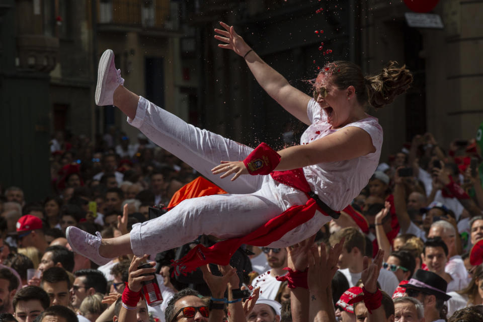 <p>Revellers enjoy the atmosphere during the opening day or ‘Chupinazo’ of the San Fermin Running of the Bulls fiesta on July 6, 2018 in Pamplona, Spain. (Photo: Pablo Blazquez Dominguez/Getty Images) </p>