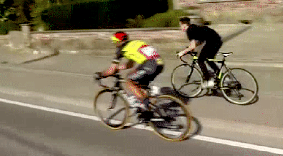 kid races bike alongside pro during race Gilbert