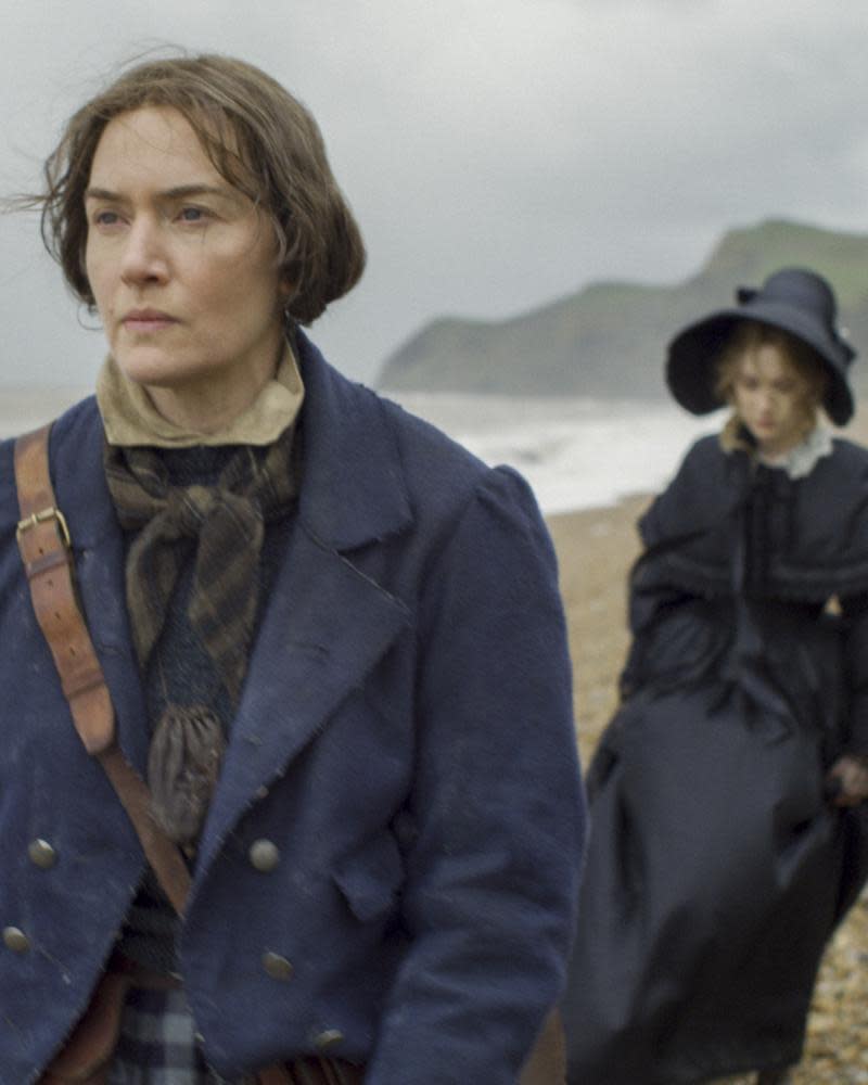 This image released by Neon shows Kate Winslet, foreground, and Saoirse Ronan in a scene from “Ammonite.” (Neon via AP)