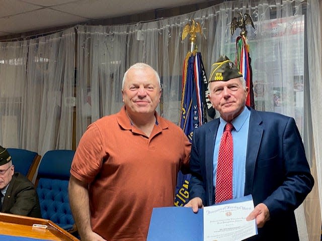 VFW Post 3308 named a "Teacher of the Year for 2021 and 2022," Wes Singletary, left, a teacher at Chiles High School at a ceremony March 3, 2023.