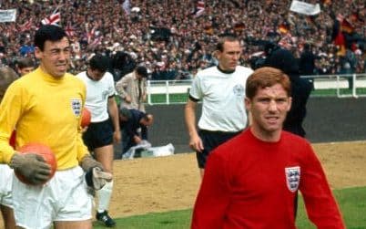 Alan Ball, right, walks out at Wembley for the 1966 World Cup final against West Germany, followed by Gordon Banks - Credit: Offside66/Getty