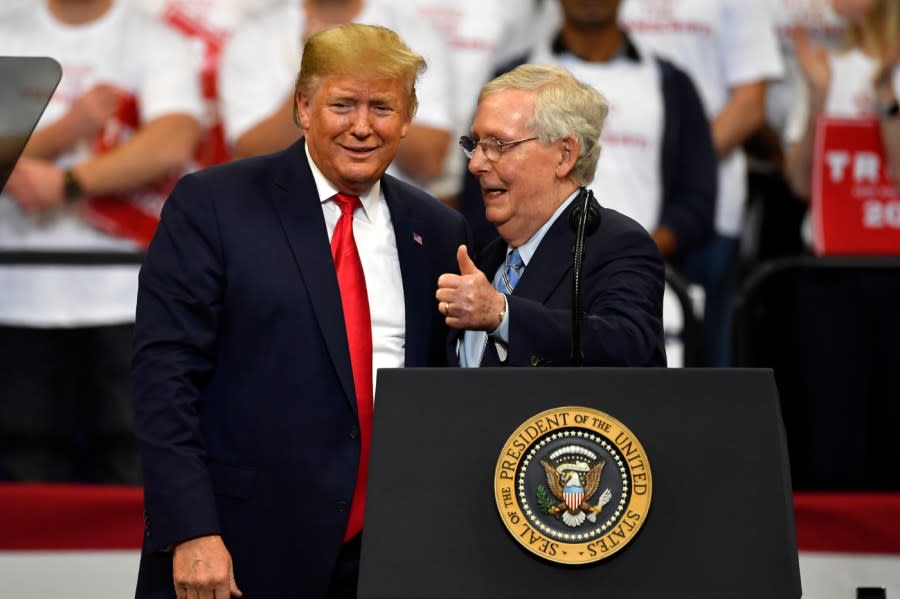 President Donald Trump, left, and Senate Majority Leader Mitch McConnell of Ky., greet each other during a campaign rally in Lexington, Ky., Monday, Nov. 4, 2019.