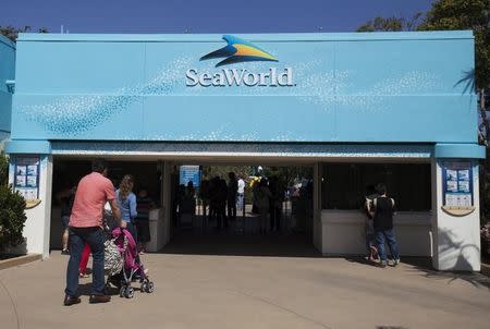 Visitors attend the animal theme park SeaWorld in San Diego, California March 19, 2014 REUTERS/Mike Blake