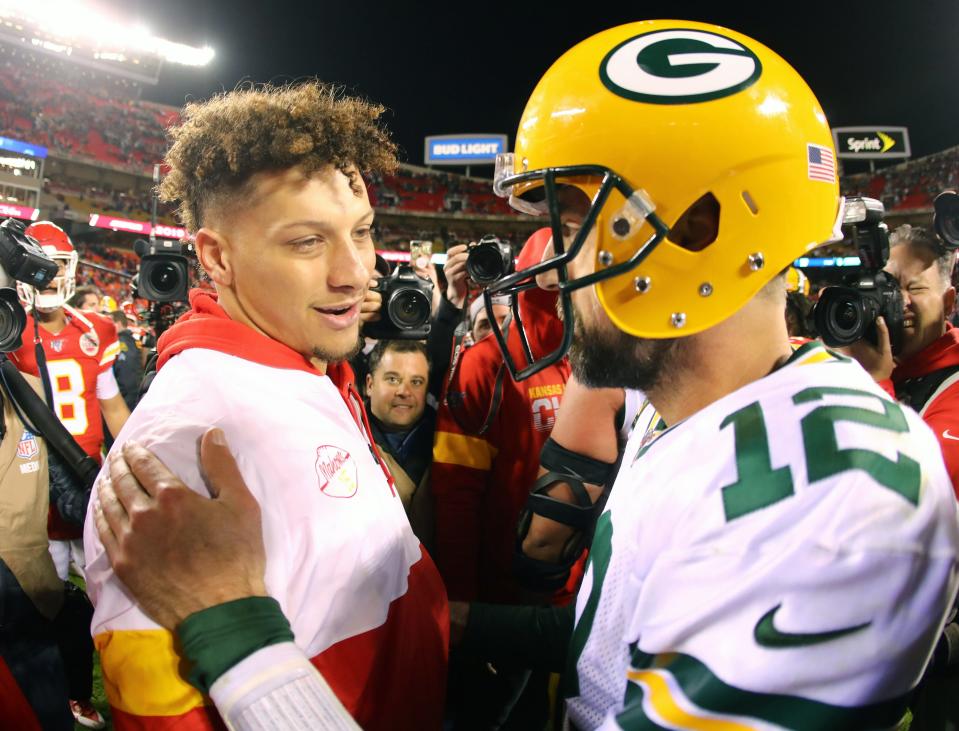 Green Bay Packers quarterback Aaron Rodgers (12) talks with Kansas City Chiefs quarterback Patrick Mahomes (15) after a 2021 game at Arrowhead Stadium.