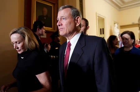 FILE PHOTO: U.S. Supreme Court Chief Justice John Roberts departs with his wife Jane after U.S. President Donald Trump concluded his second State of the Union address to a joint session of the U.S. Congress in the House Chamber of the U.S. Capitol in Washington, U.S. February 5, 2019. REUTERS/Joshua Roberts/File Photo