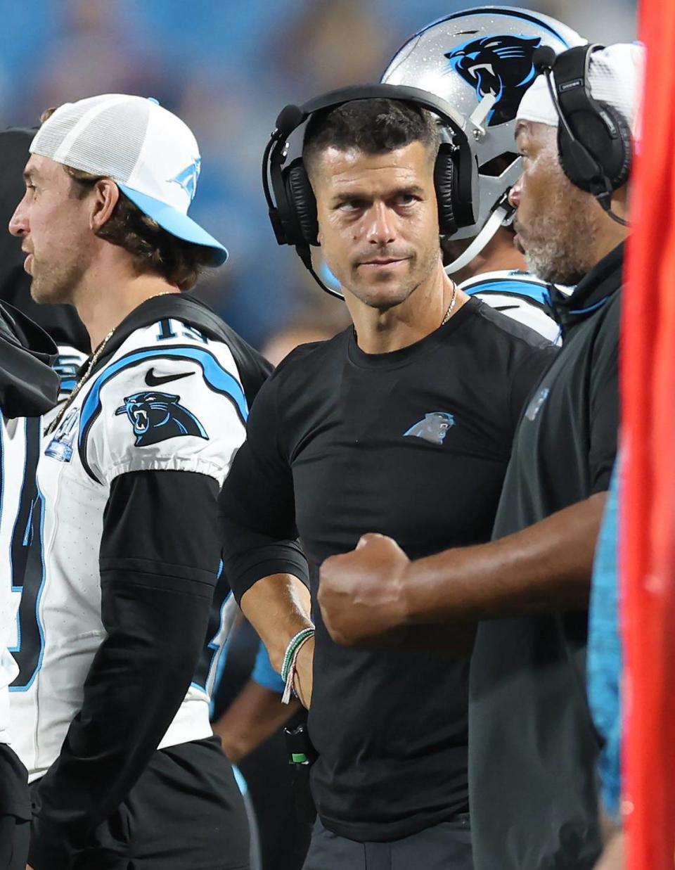 Carolina Panthers head coach Dave Canales, center, talks with an assistant coach along the sidelines during fourth quarter action against the New York Jets at Bank of America Stadium in Charlotte, NC on Saturday, August 17, 2024. The Jets defeated the Panthers 15-12.