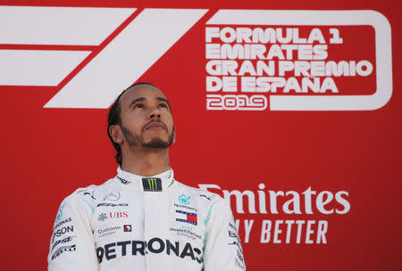 FILE PHOTO: Formula One F1 - Spanish Grand Prix - Circuit de Barcelona-Catalunya, Barcelona, Spain - May 12, 2019 First placed Mercedes' Lewis Hamilton on the podium. REUTERS/Jon Nazca