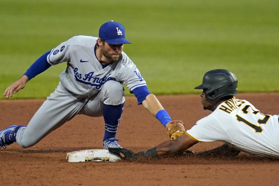 Dodgers second baseman Chris Taylor puts the tag on Pittsburgh Pirates' Ke'Bryan Hayes.