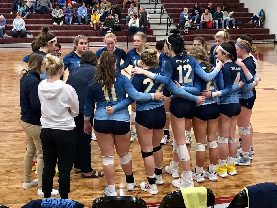 River Valley gathers during a timeout at last year's Division II volleyball district semifinal match against London at Licking Heights.