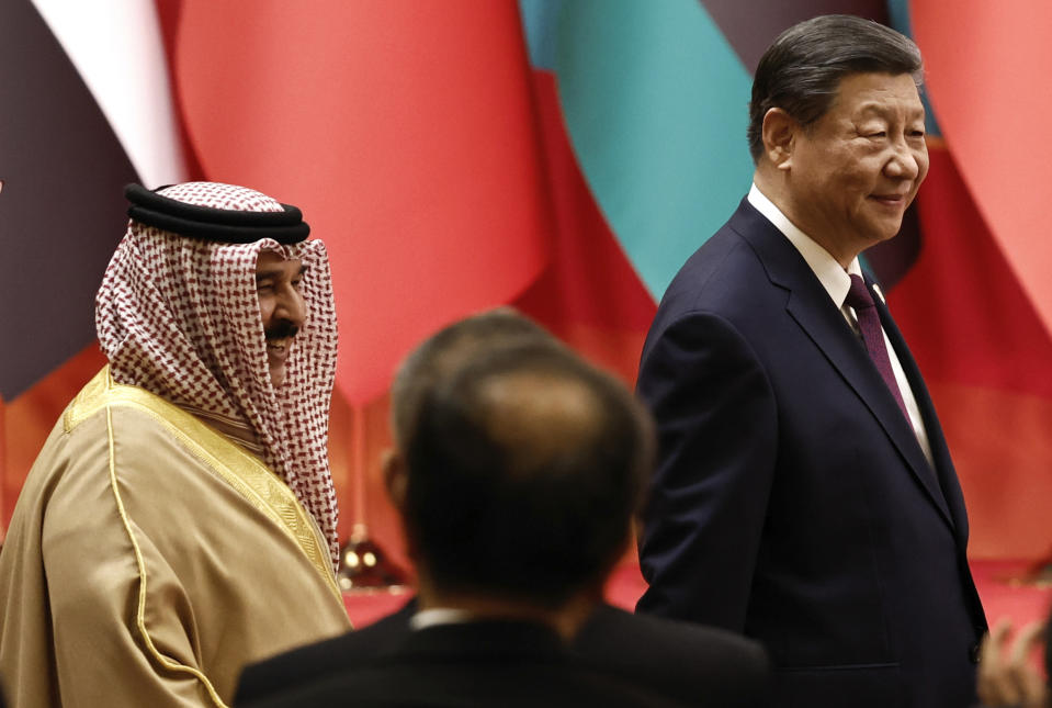 Chinese President Xi Jinping, right, and Bahrain's King Hamad bin Isa Al Khalifa arrive to attend the opening ceremony of the 10th ministerial meeting of the China-Arab States Cooperation Forum at the Diaoyutai State Guesthouse in Beijing Thursday, May 30, 2024. (Tingshu Wang/Pool Photo via AP)