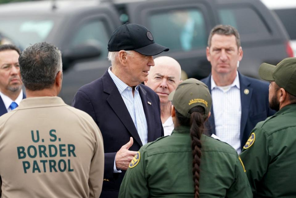 Joe Biden, flanked by US Homeland Security Secretary Alejandro Mayorkas, receives a briefing at the US-Mexico border in Brownsville, Texas (REUTERS)