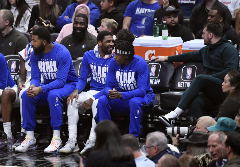 Kyrie Irving at Luka Doncic have had the opportunity to bond in Luka's absence from the court. (Photo by Kevork Djansezian/Getty Images)