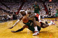 MIAMI, FL - MAY 30: LeBron James #6 of the Miami Heat falls to the court on top of Rajon Rondo #9 of the Boston Celtics in Game Two of the Eastern Conference Finals in the 2012 NBA Playoffs on May 30, 2012 at American Airlines Arena in Miami, Florida. NOTE TO USER: User expressly acknowledges and agrees that, by downloading and or using this photograph, User is consenting to the terms and conditions of the Getty Images License Agreement. (Photo by Mike Ehrmann/Getty Images)