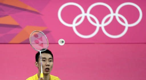 Malaysia's Lee Chong Wei returns a shot to Ville Lang of Finland during their men's singles badminton match at the London 2012 Olympic Games in London. Wei won 21-8,14-21,21-11