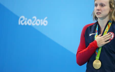 2016 Rio Olympics - Swimming - Victory Ceremony - Women's 800m Freestyle Victory Ceremony - Olympic Aquatics Stadium - Rio de Janeiro, Brazil - 12/08/2016. Katie Ledecky (USA) of USA poses with her gold medal. REUTERS/Michael Dalder