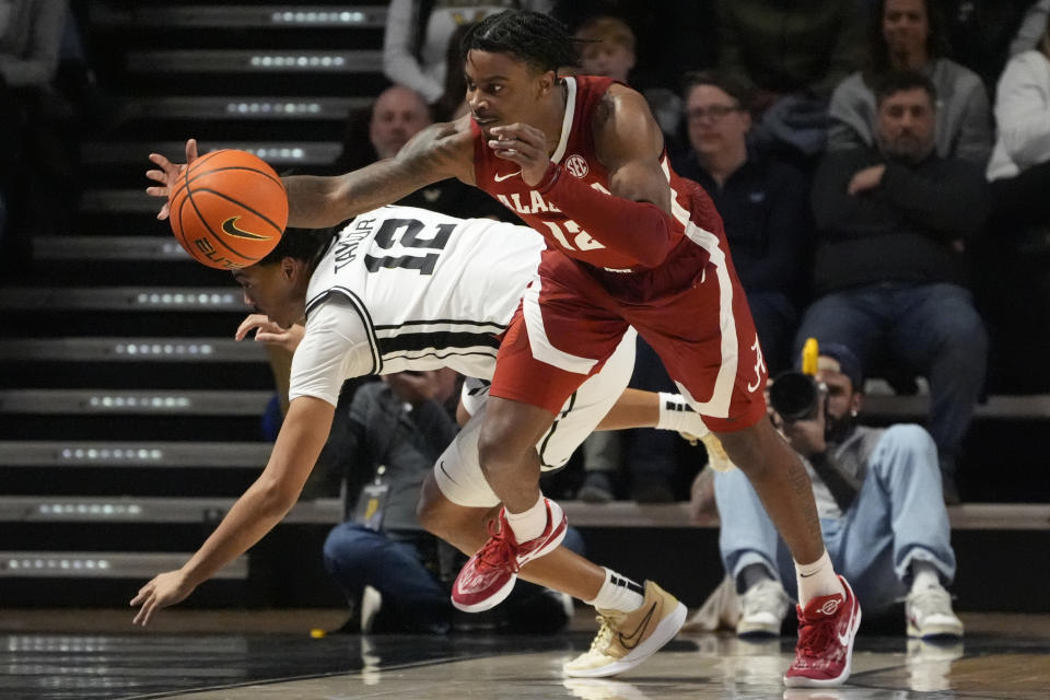 Alabama guard Latrell Wrightsell Jr. (12) chases a loose ball past Vanderbilt guard Evan Taylor (12) during the second half of an NCAA college basketball game Saturday, Jan. 6, 2024 in Nashville, Tenn. Alabama won 75-78. (AP Photo/George Walker IV)