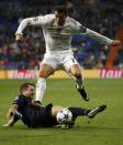 Football Soccer - Real Madrid v Malmo - Champions League Group Stage - Group A - Santiago Bernabeu, Madrid, Spain - 8/12/15 Real Madrid's Cristiano Ronaldo in action against Malmo's Kari Arnason. REUTERS/Juan Medina