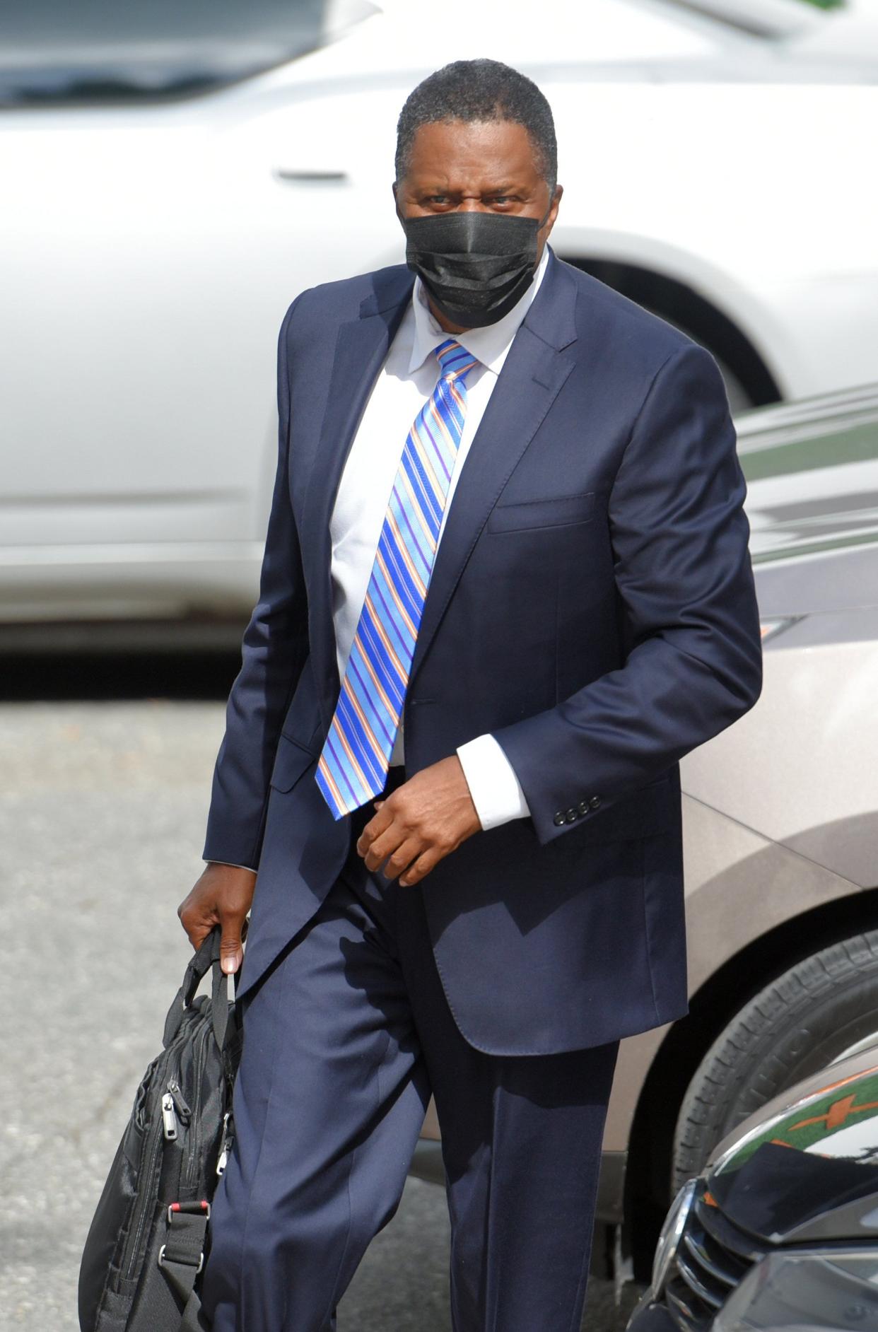 Former Jacksonville City Council member Reggie Brown, shown here before his October 2020 sentencing on fraud charges, is asking a judge to delay the government seizing his house to help pay a $411,000 forfeiture order.