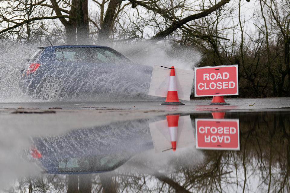 A car drives through floodwater on a road near Mountsorrel, Leicestershire. Picture date: Tuesday March 14, 2023. (Photo by Joe Giddens/PA Images via Getty Images)