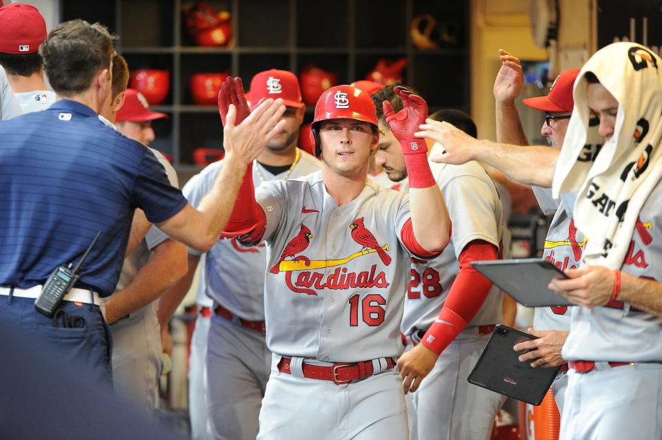Cardinals third baseman Nolan Gorman is congratulated in the dugout after hitting a home run against the Brewers in the fourth inning Tuesday night at American Family Field.