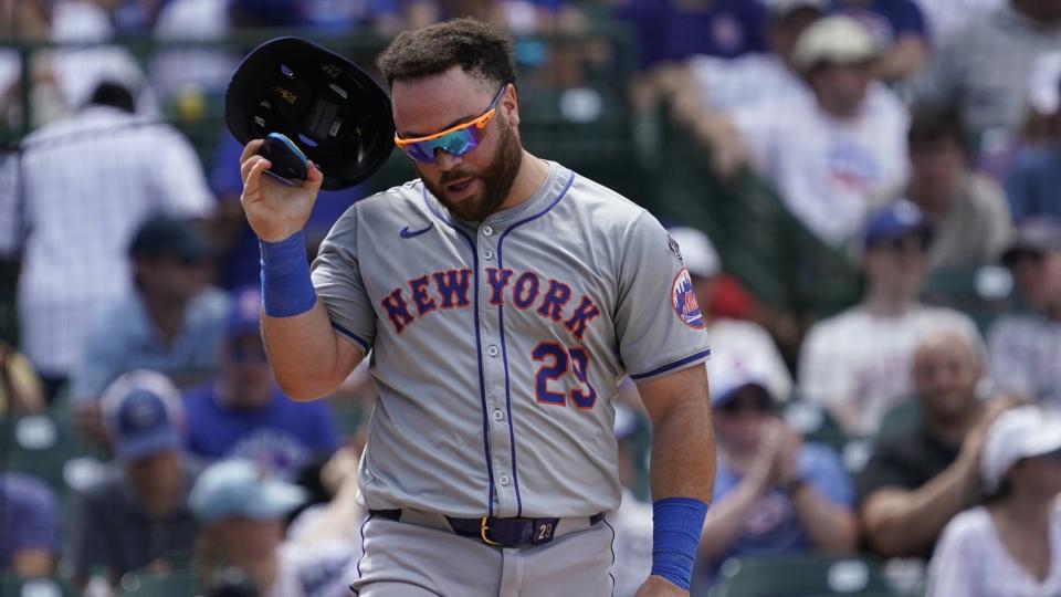 Jun 22, 2024; Chicago, Illinois, USA; New York Mets pitcher David Peterson (23) reacts after being called out on strikes against the Chicago Cubs during the sixth inning at Wrigley Field. 