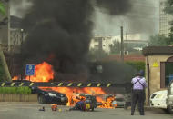 This frame taken from video shows a scene of an explosion in Kenya's capital, Nairobi, Tuesday Jan. 15, 2019. Gunfire and explosions were reported near an upscale hotel complex. (AP Photo/Josphat Kasire)