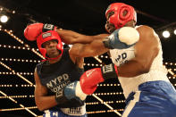 <p>Larry Carson (red) fights Kevon Sample (blue) in the LT Rumble Match at the NYPD Boxing Championships at the Hulu Theater at Madison Square Garden on March 15, 2018. (Gordon Donovan/Yahoo News) </p>