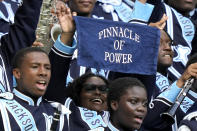 A member of the Jackson State Sonic Boom of the South marching band holds up a towel reading "Pinnacle of Power," during the second half of the Orange Blossom Classic NCAA college football game against Florida A&M, Sunday, Sept. 3, 2023, in Miami Gardens, Fla. (AP Photo/Lynne Sladky)