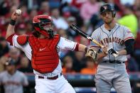 Hunter Pence #8 of the San Francisco Giants reacts after striking out as catcher Ryan Hanigan #29 of the Cincinnati Reds throws the ball back to the pitcher in the second inning in Game Three of the National League Division Series at the Great American Ball Park on October 9, 2012 in Cincinnati, Ohio. (Photo by Jonathan Daniel/Getty Images)