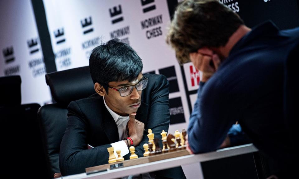 <span>Praggnanandhaa Rameshbabu in action against Magnus Carlsen in the third round of the Norway Chess event at Stavanger.</span><span>Photograph: Stev Bonhage/Norway Chess</span>