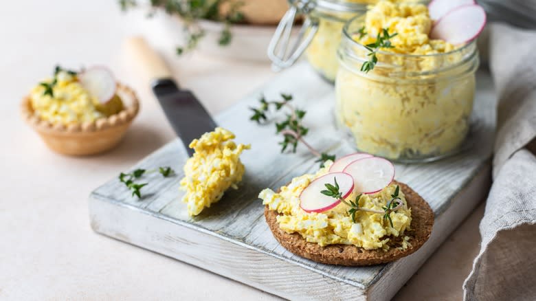 Deviled egg dip on a cracker