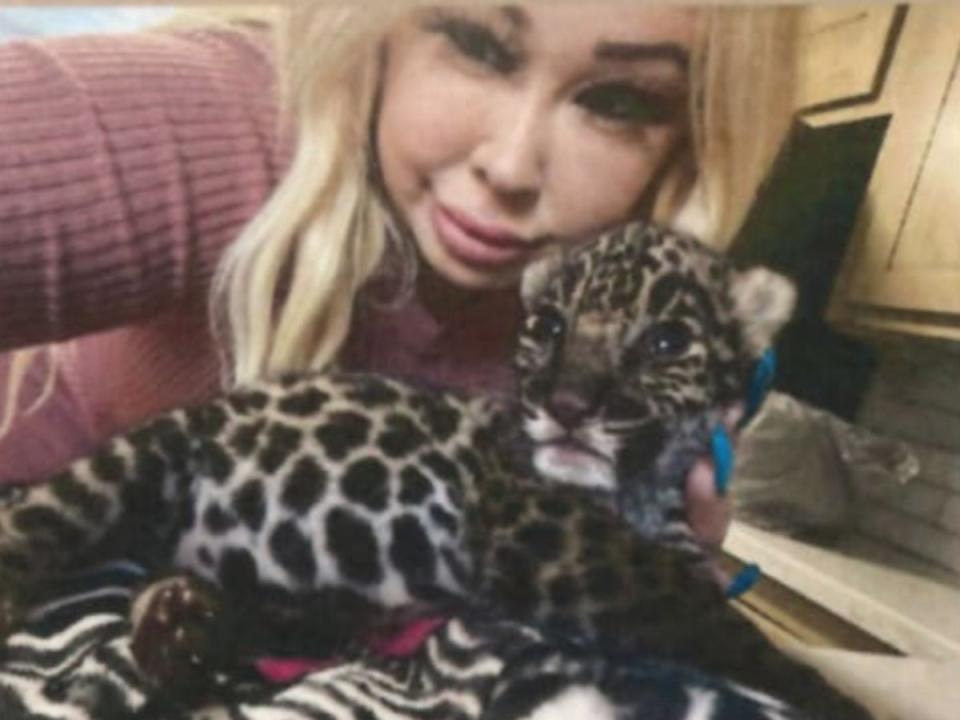 A screenshot of a social media post showing Trisha Denise Meyer, 40, holding a jaguar cub, which she is accused of selling off for $30,000 (U.S. District Court for the Central District of California)