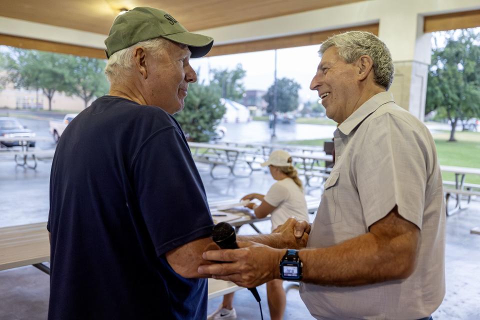 Robert Craig shakes hands with Utah 2nd Congressional District candidate Bruce Hough at a gathering at Bountiful Park on Wednesday, July 19, 2023. | Scott G Winterton, Deseret News