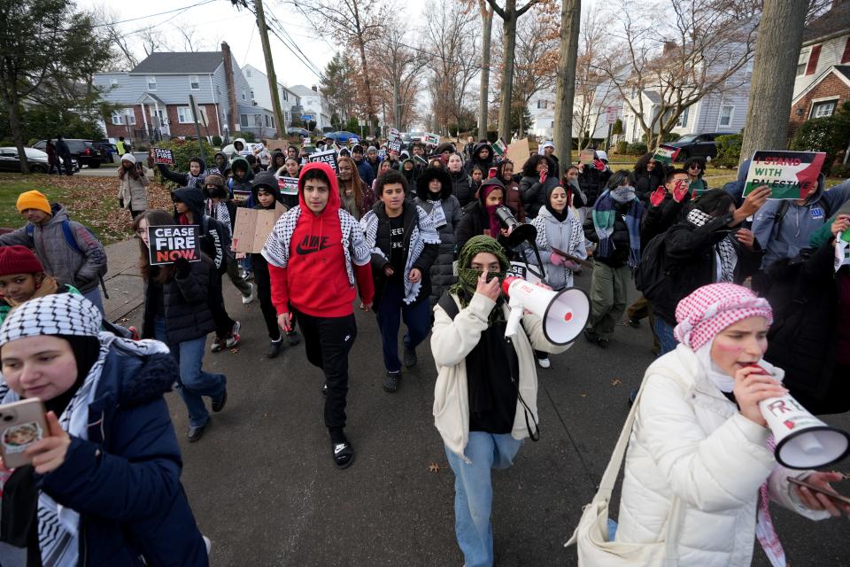 Students are shown as they walk away from Teaneck High School and towards the football field Wednesday afternoon, November 29, 2023. The students were protesting the war in the Middle East after leaving class.
