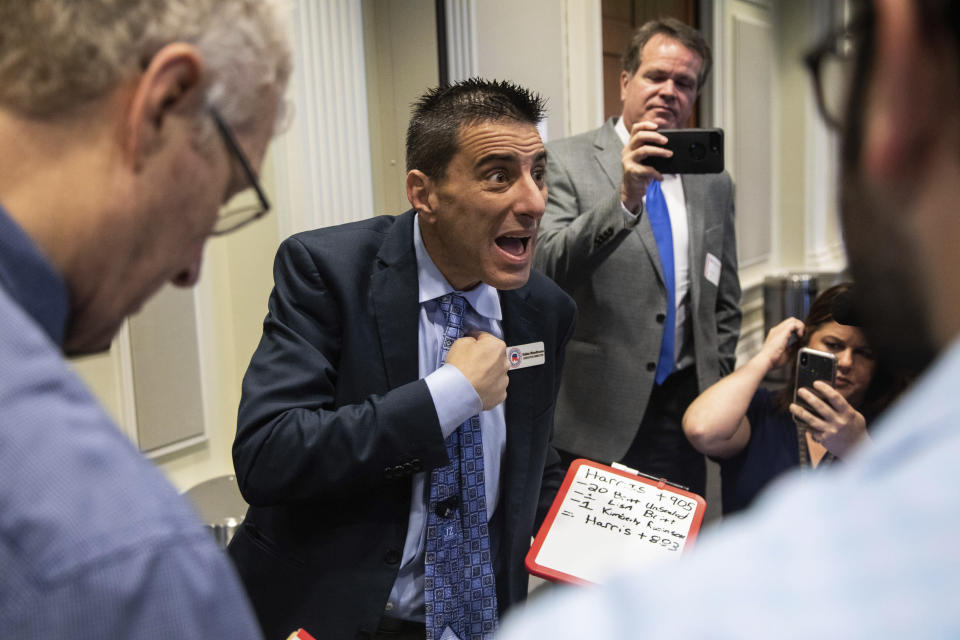 Dallas Woodhouse, executive director of the North Carolina Republican Party, talks with reporters prior to the second day of a public evidentiary hearing on the 9th congressional district voting irregularities investigation Tuesday, Feb. 19, 2019, at the North Carolina State Bar in Raleigh, N.C. North Carolina elections officials looking into ballot fraud in the country's last undecided congressional election are finding that votes were counted days ahead of Election Day in the rural county at the center of disputed results. (Travis Long/The News & Observer via AP, Pool)