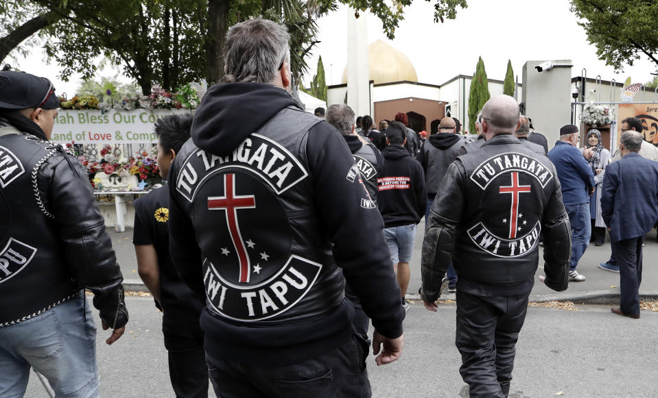 Members of the Tu Tangata motorcycle club walk into the Al Noor mosque in Christchurch, New Zealand, Sunday, March 15, 2020. A national memorial in New Zealand to commemorate the 51 people who were killed when a gunman attacked two mosques one year ago has been canceled due to fears over the new coronavirus. (AP Photo/Mark Baker)