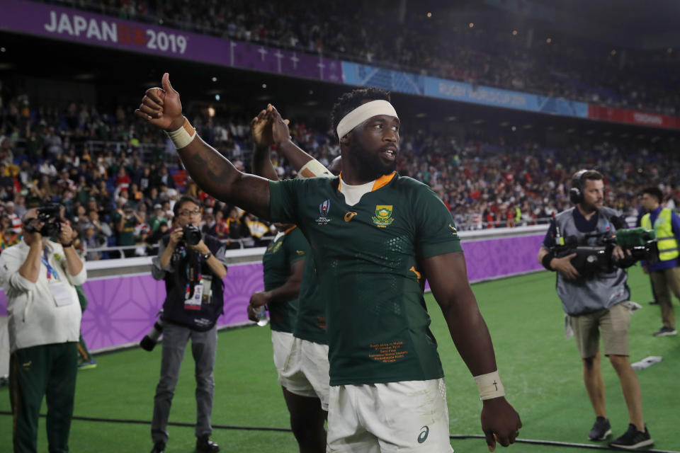 South Africa's Siya Kolisi celebrates after the Rugby World Cup semifinal at International Yokohama Stadium between Wales and South Africa in Yokohama, Japan, Sunday, Oct. 27, 2019. South Africa won 19-16. (AP Photo/Christophe Ena)